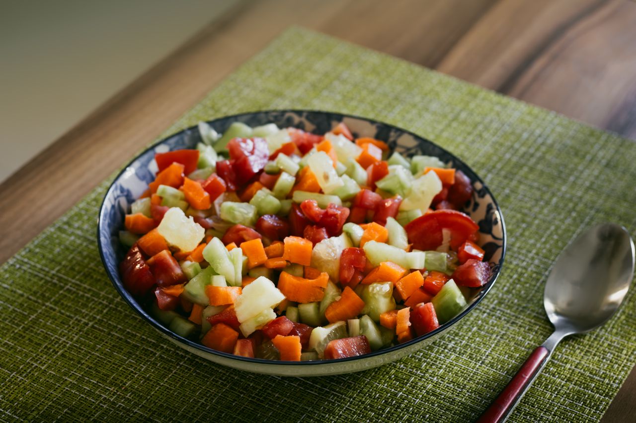 hero-gallery-02 A vibrant vegan salad with mixed vegetables in a rustic bowl, perfect for healthy eating.