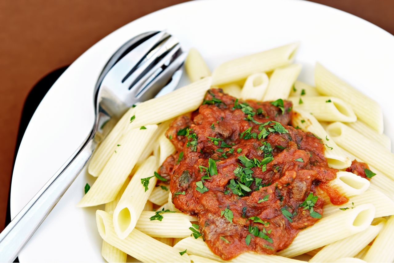 hero-gallery-03 Mouthwatering penne pasta with rich tomato sauce garnished with fresh herbs.